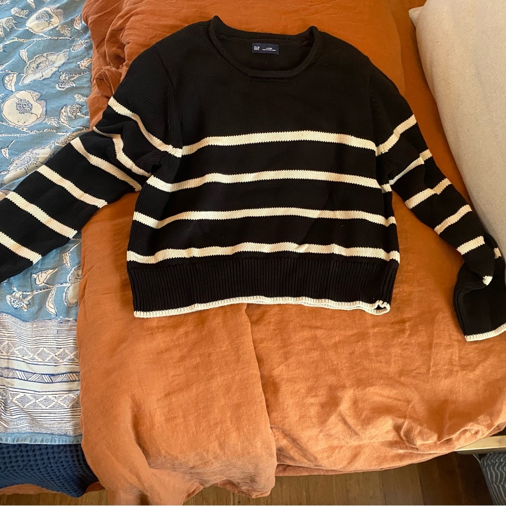 Black and white striped women’s sweater.